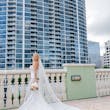 Bride Wearing Lace Mermaid Wedding Dress Called Bronson By Sottero And Midgley With A Tulle Veil