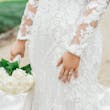 Bride In Sexy Lace Wedding Dress With Plunging Neckline Called Cruz By Sottero and Midgley With Simple Engagement Ring