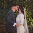 Bride Wearing Simple Keyhole Back Wedding Dress Called Aston By Sottero and Midgley Kissing Groom