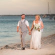 Groom With Bride Wearing Boho-Chic Lace A-Line Wedding Dress Courtney By Rebecca Ingram