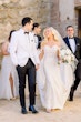 Bride In Crepe And Lace Wedding Dress Called Beverly By Rebecca Ingram With Groom And Bridal Party