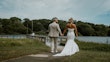 Bride wearing Damiana by Sottero and Midgley walking with her husband