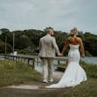 Bride wearing Damiana by Sottero and Midgley walking with her husband