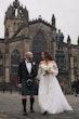 Bride wearing Nerida by Sottero and Midgley walking with her husband