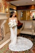 Bride Wearing Lace Fit And Flare Wedding Dress Called Fairchild By Maggie Sottero In A Hotel Room