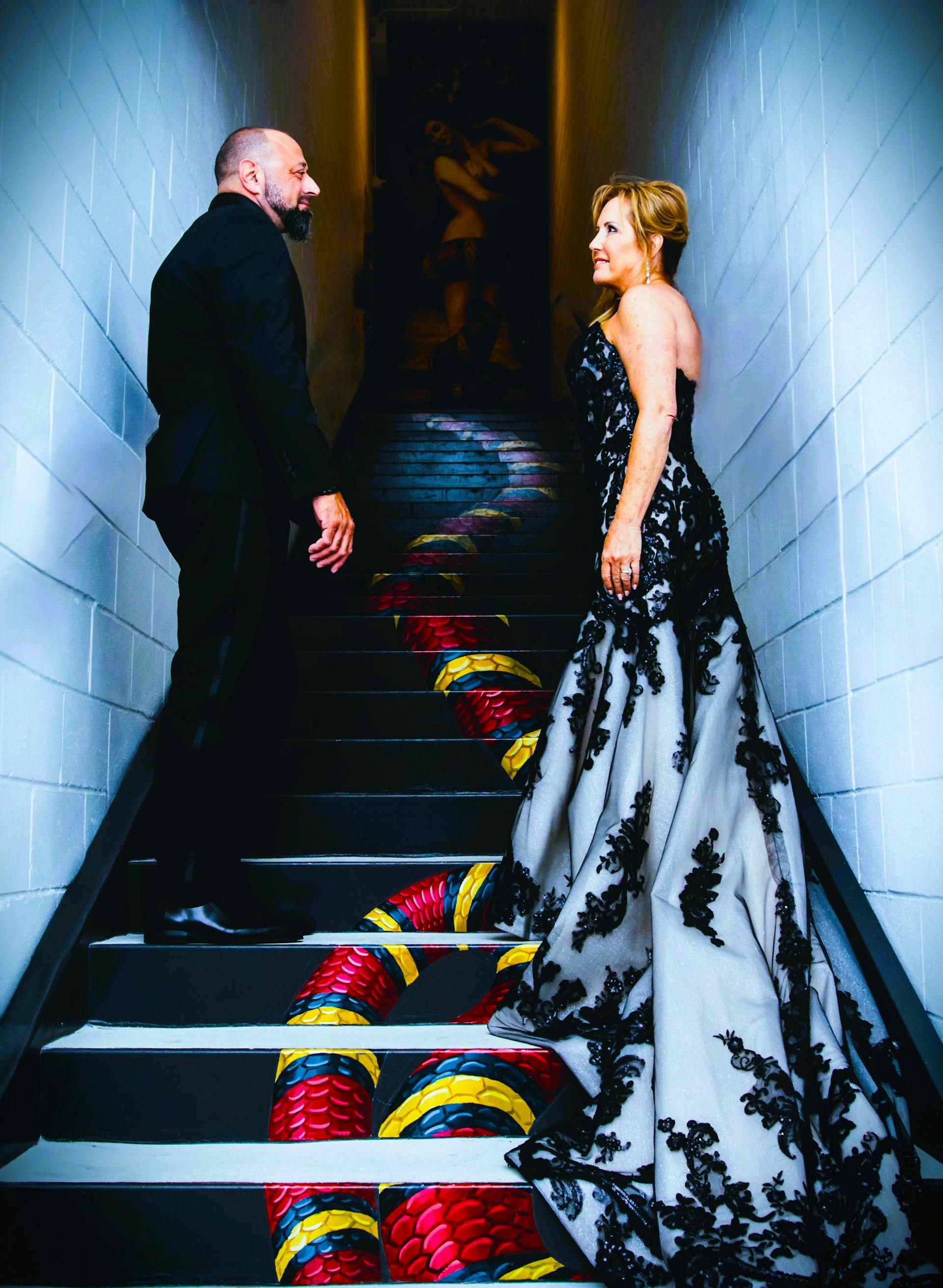Bride Wearing Black Lace Wedding Dress Called Norvinia Lane By Sottero And Midgley With Groom In A Dim Lit Stairway