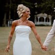 Bride wearing Damiana by Sottero and Midgley holding hands with her husband