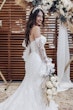 Bride wearing Ryker wedding dress by Sottero and Midgley