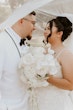 Bride wearing Stevie by Maggie Sottero under her veil with her husband