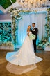 Bride wearing Zinaida by Maggie Sottero with her husband