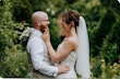 Bride wearing Lorraine by Rebecca Ingram with her husband