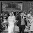 Bride wearing Yates wedding dress by Maggie Sottero with flower petals being thrown