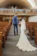 Groom and Bride Wearing Beaded Lace Off-the-Shoulder Wedding Gown Called Elias by Sottero and Midgley