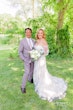 Bride wearing Demetria by Maggie Sottero with her husband