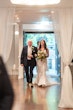 Bride wearing Tuscany Lynette being walked down the aisle by her father