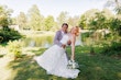 Bride wearing Demetria by Maggie Sottero being dipped by her husband