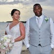 Bride wearing Franklynn by Sottero and Midgley with her husband on the beach