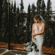 Bride in romantic lace sheath wedding dress