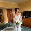 Bride Wearing Sheath and Beaded Wedding Dress Called Doritte By Maggie Sottero In A Hotel Room