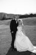 Bride wearing Selena by Maggie Sottero with her husband