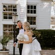 Groom Walking With Bride In A White Strapless Wedding Dress Named Mitchell By Maggie Sottero