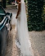 Bride wearing Fontaine by Maggie Sottero next to a car