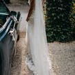 Bride wearing Fontaine by Maggie Sottero next to a car
