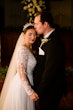 Bride wearing Lorraine Dawn wedding dress by Rebecca Ingram kissing her husband