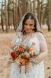 Bride Wearing Lace Wedding Dress Called Ladonna By Maggie Sottero With A Fall Color Bouquet