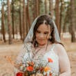 Bride Wearing Lace Wedding Dress Called Ladonna By Maggie Sottero With A Fall Color Bouquet