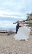 Bride In Chiffon Wedding Dress Called Tasha By Rebecca Ingram With Groom