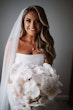 Bride wearing Holden wedding dress by Sottero and Midgley holding her bouquet