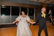 Bride wearing Juniper by Sottero and Midgley with her husband dancing