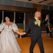 Bride wearing Juniper by Sottero and Midgley with her husband dancing