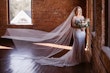 Bride Wearing Classic Elegant Wedding Dress Called Sebastiane By Maggie Sottero With Long Veil And Flower Bouquet
