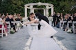 Bride wearing Barcelona by Sottero and Midgley being kissed by her husband