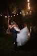 Bride wearing Holden wedding dress by Sottero and Midgley being held by her husband