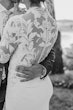 Bride Wearing Crepe And Lace Bridal Dress Called Dionne By Rebecca Ingram With Groom Holding Her