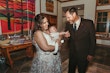 Bride Wearing Lace Wedding Dress Called Ladonna By Maggie Sottero Holding Her Baby With Groom