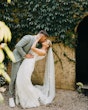 Bride wearing Fontaine by Maggie Sottero kissing her husband