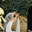 Bride wearing Fontaine by Maggie Sottero kissing her husband