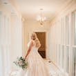 Bride wearing a plus size ballgown wedding dress.