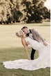 Bride wearing Tuscany Royale by Maggie Sottero kissing her husband