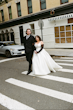 Bride Wearing Simple Aline Wedding Dress Called Selena By Maggie Sottero With Groom Walking Across The Street