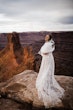 Bride Wearing A White A Line Wedding Dress Named Keisha By Maggie Sottero With Views Of Red Rock In The Background