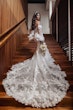 Bride wearing Ryker wedding dress by Sottero and Midgley walking up stairs