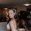 Bride Wearing Beaded Fit-n-flare Wedding Dress Called Jonah Lane By Sottero And Midgley Getting Dressed