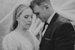 Bride and groom forehead to forehead.