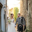 Bride wearing Iris wedding dress by Rebecca Ingram with her husband