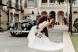 Bride Wearing Lace Mermaid Wedding Gown Called Montgomery By Sottero and Midgley Kissing Groom